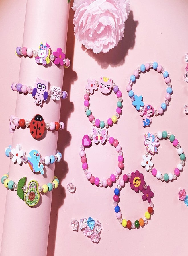 مجموعة SIELEVIN المكونة من 12 قطعة من أساور الخرز الخشبية للبنات، بتصميمات يونيكورن وحورية البحر، مثالية كهدية عيد ميلاد أو هدية مميزة. تتضمن المجموعة أساور لطيفة بألوان قوس قزح وفراشات وقلوب. - Image 2